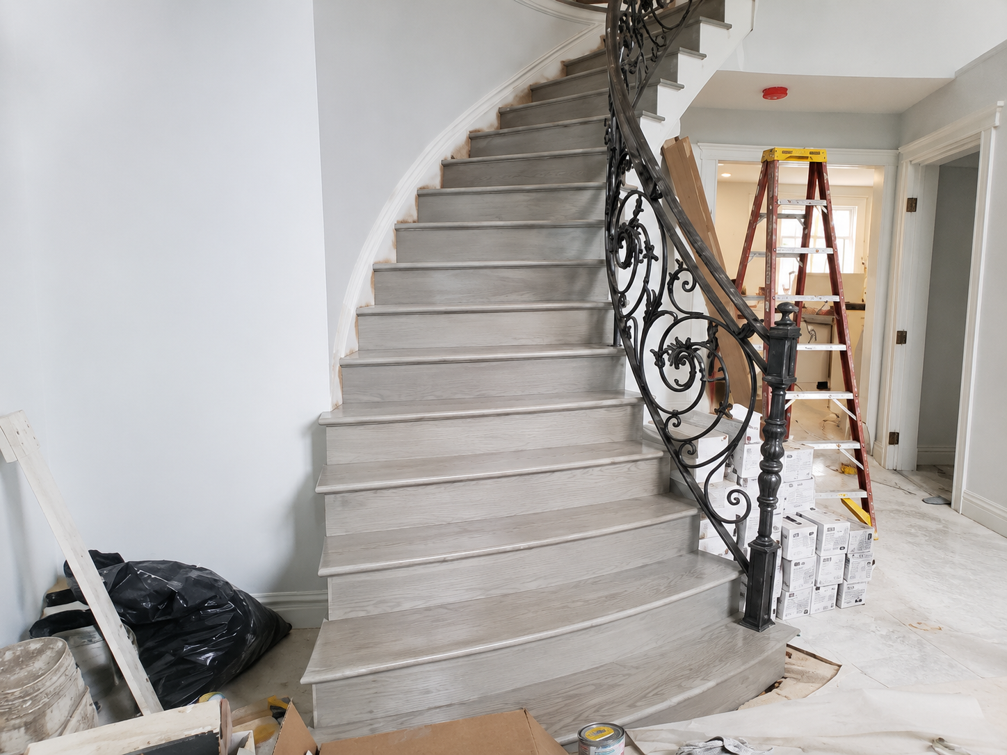 Curved wrought-iron staircase, wide shot